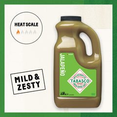 TABASCO green pouring onto taco to add mild heat and bright flavor