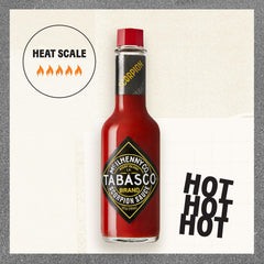 TABASCO scorpion being poured over food showing fast dispensing and flavor boost