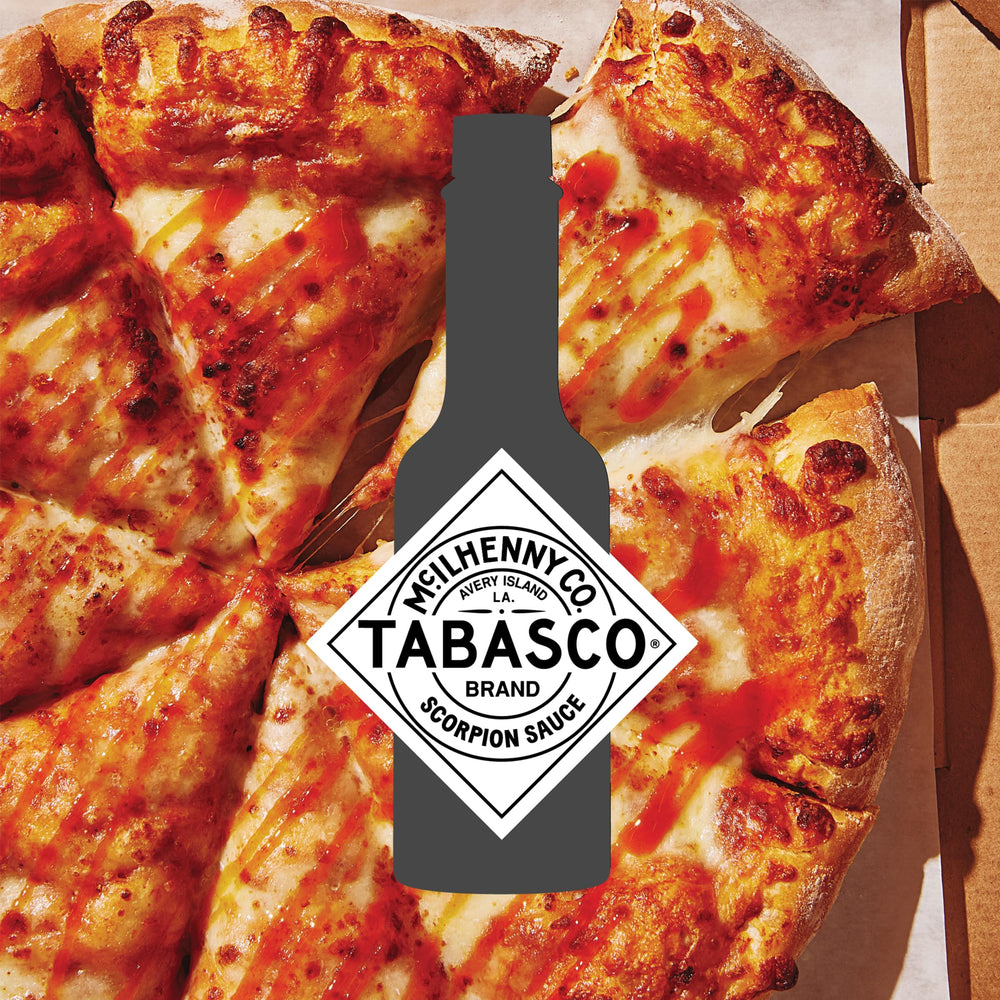 TABASCO scorpion next to measuring cup showing 64 oz scale and bulk value
