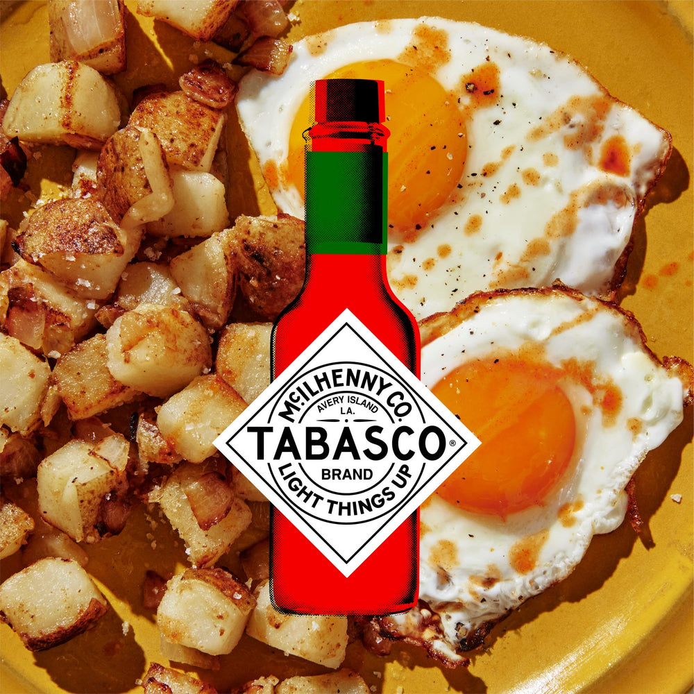 TABASCO packet next to fork demonstrating compact 0.11 oz size and portable convenience