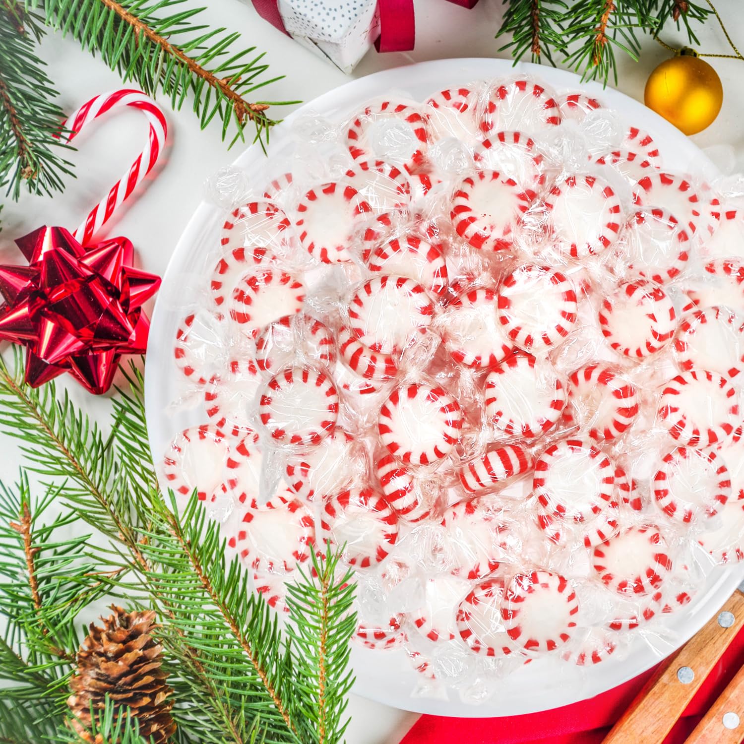 Taboom party table with peppermints on dessert spread, enhancing holiday decor