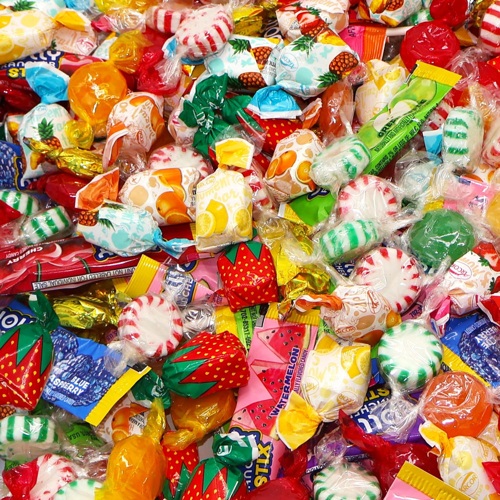 Taboom hand holding candy next to ruler showing size and approximate piece count