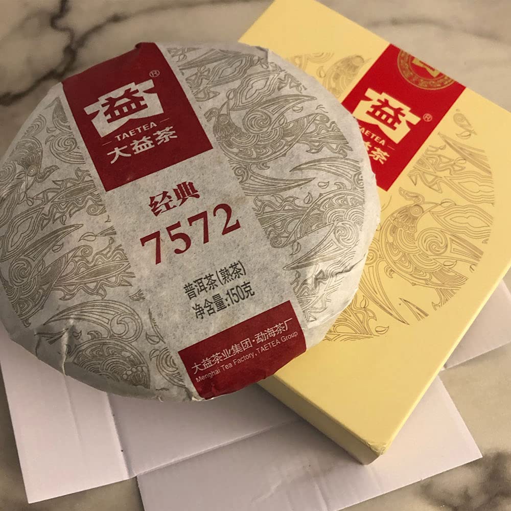 TAETEA cake held in hand for size comparison and portioning ease