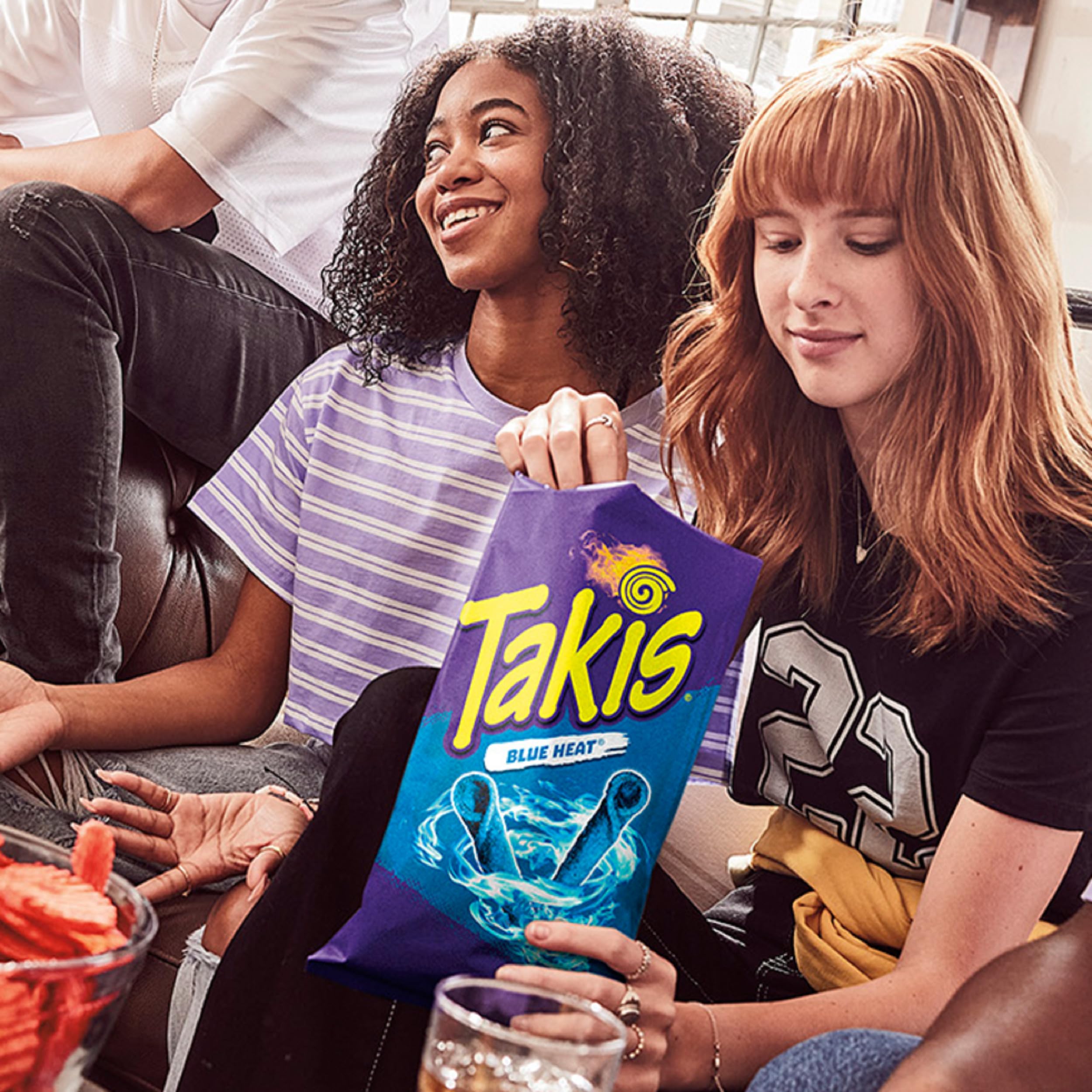 Takis blue heat texture detail of rolled chip for intense flavor and crisp bite