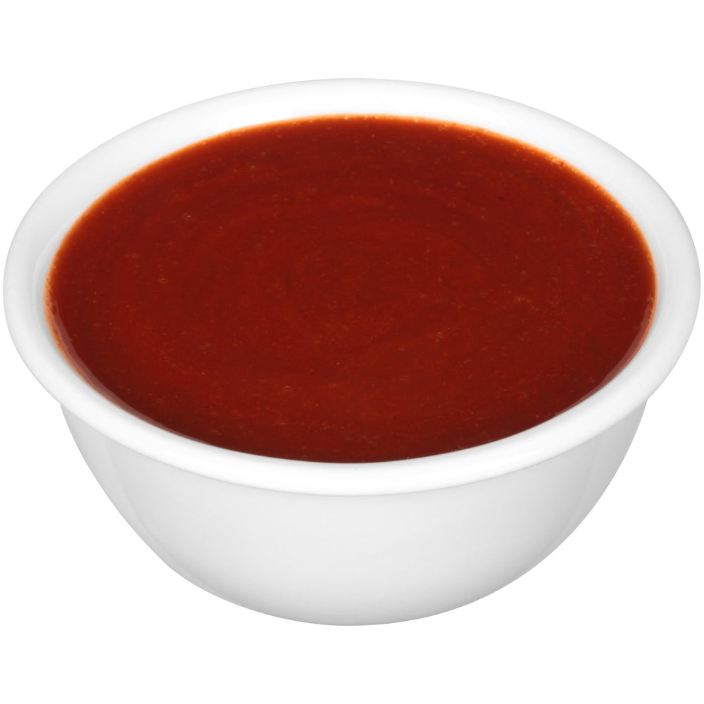 Tapatio packet being squeezed onto a taco adding spicy, balanced flavor