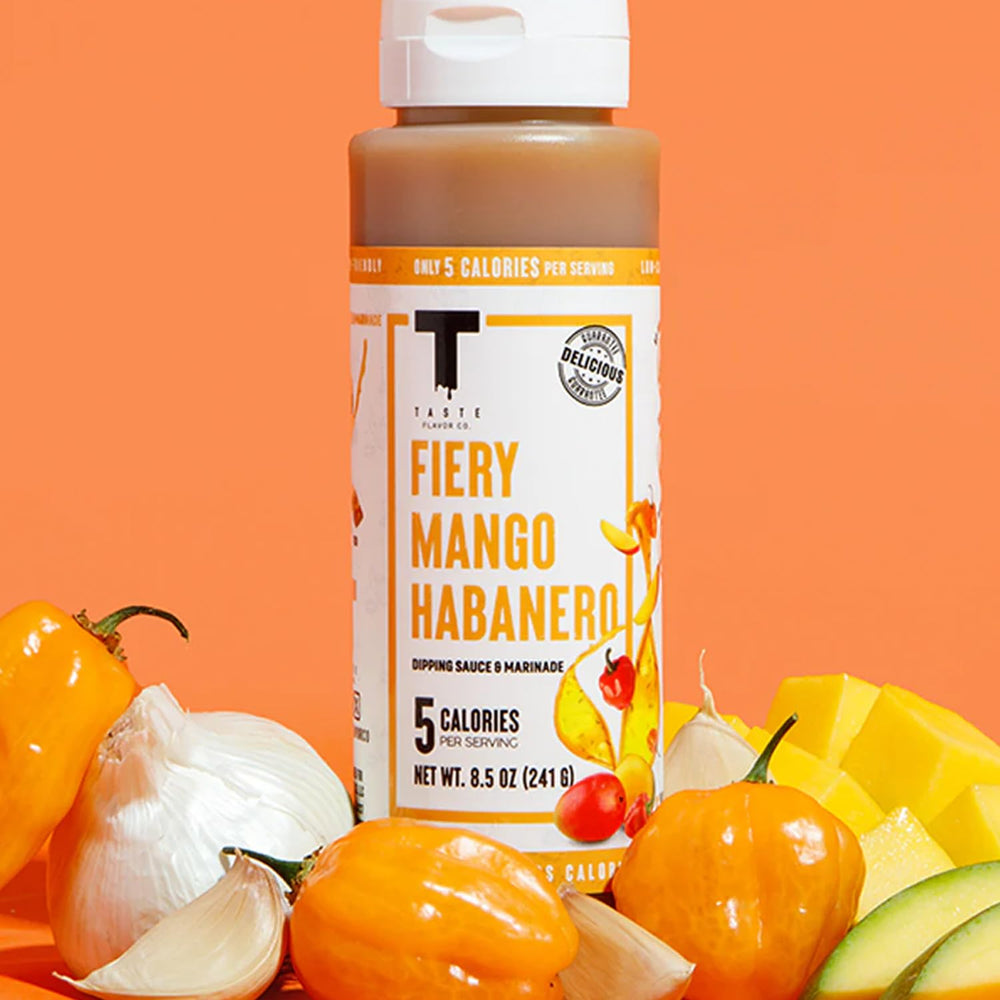 Taste Flavor Co. bottle on grill-side table with food, inspires entertaining and quick meals