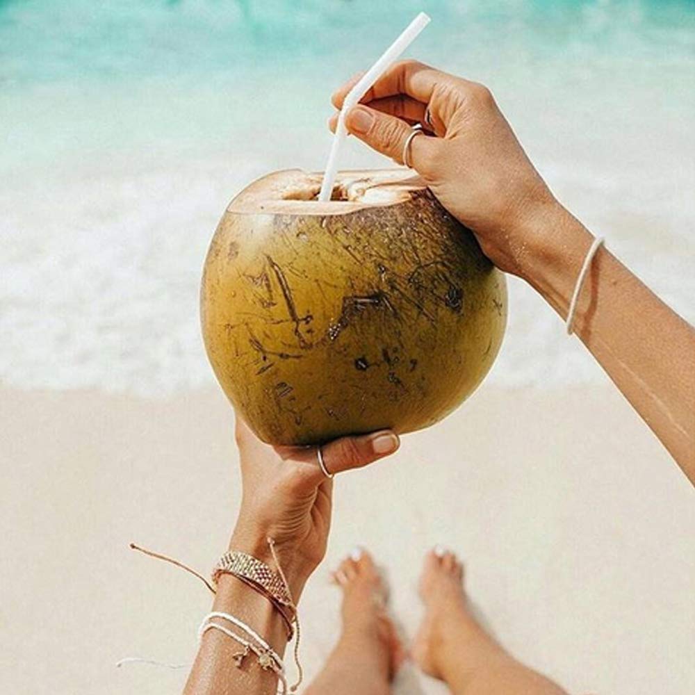 Taste Nirvana bottle in a beach cooler showing on-the-go refreshment benefit