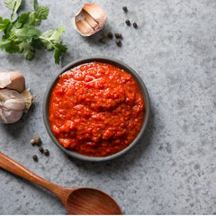Taste of Portugal jar beside measuring spoon showing 370g size for multiple meals
