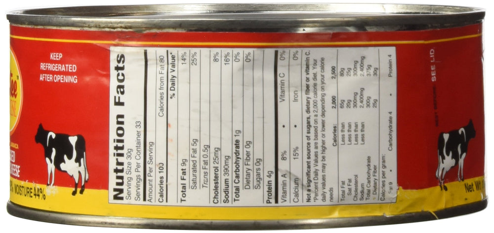 Tastee Cheese next to a ruler and knife showing 2.2 lb size for portioning