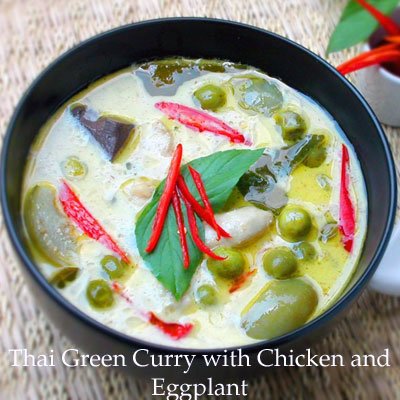 TastePadThai Mae Ploy green curry paste stirred into coconut milk showing vibrant flavor