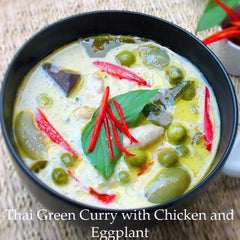 TastePadThai Mae Ploy green curry paste stirred into coconut milk showing vibrant flavor