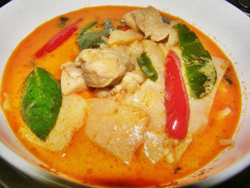TastePadThai Mae Ploy yellow curry paste jar with spoon for size scale and serving ideas
