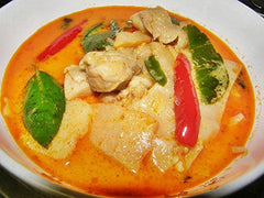TastePadThai Mae Ploy yellow curry paste jar with spoon for size scale and serving ideas