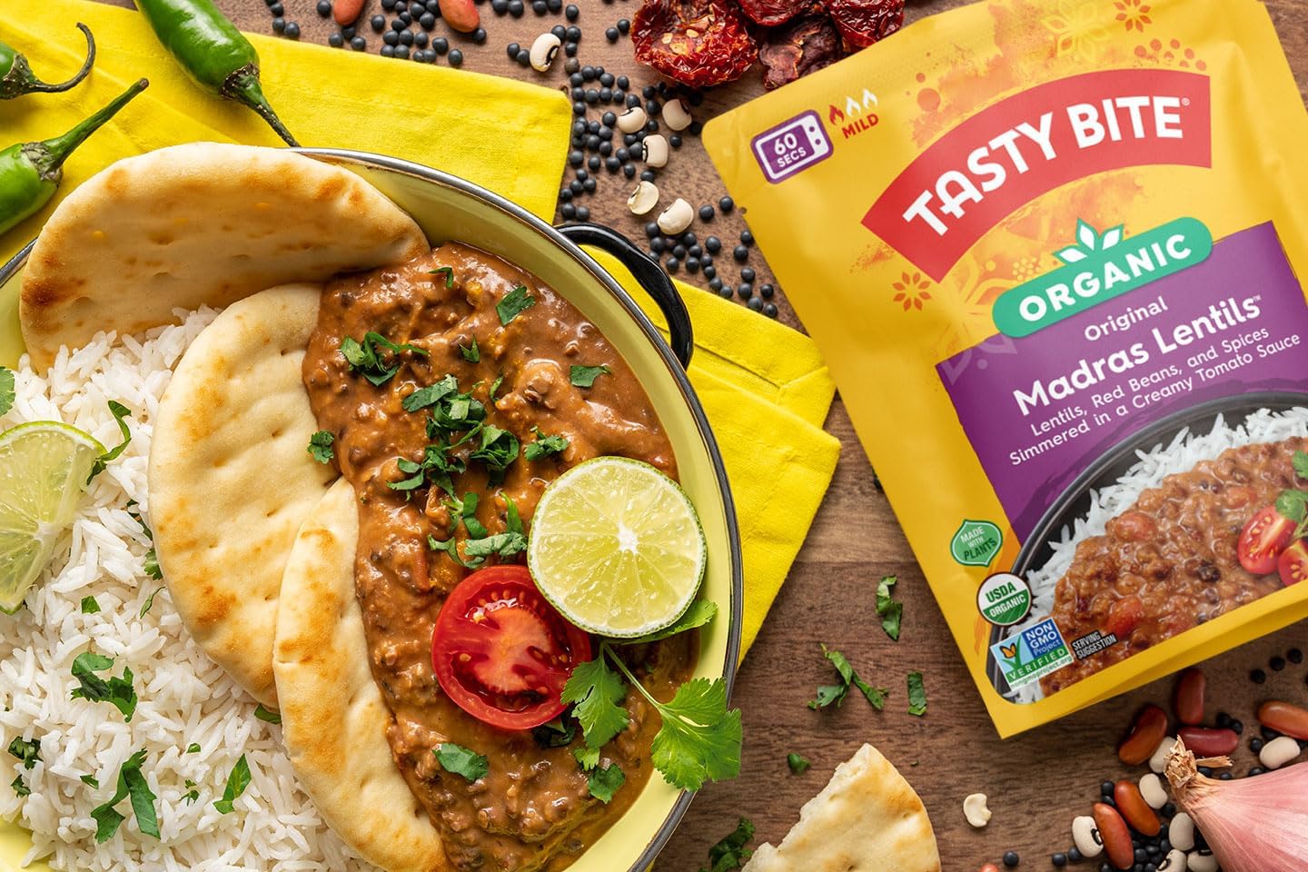 TASTY BITE pouch in hand for scale, demonstrates compact size and travel-friendly convenience