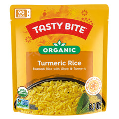 TASTY BITE spoon serving turmeric rice in bowl for fast meal convenience