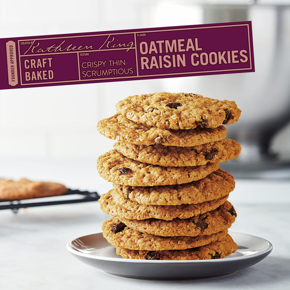 Tate's Bake Shop cookie with bite revealing oats and raisins, shows chew and flavor