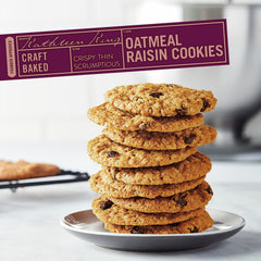 Tate's Bake Shop cookie with bite revealing oats and raisins, shows chew and flavor