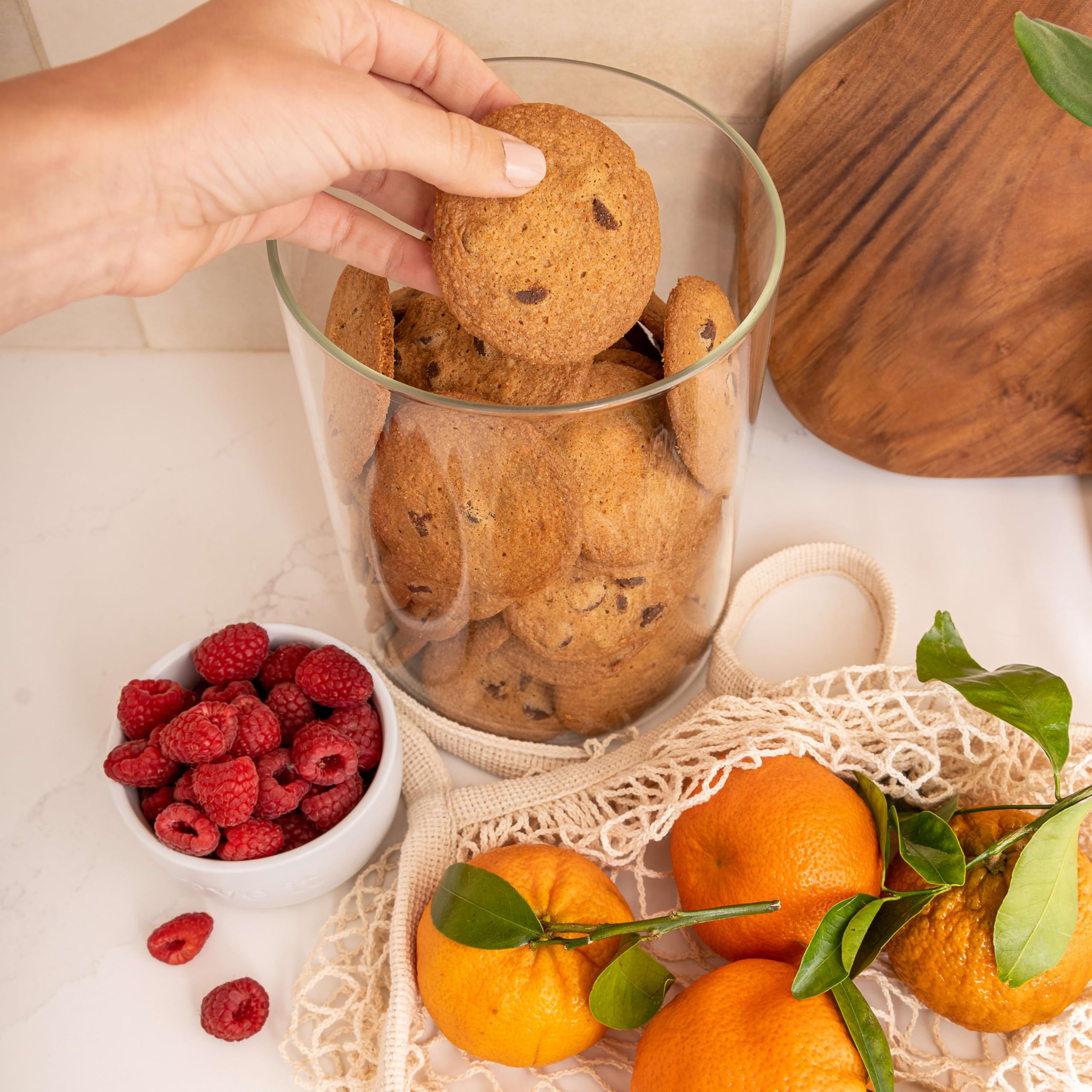 Tate's Bake Shop cookie scale in hand to show size for snacking portion