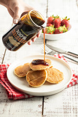 Tavusker pouring mulberry syrup close-up highlighting smooth texture benefit
