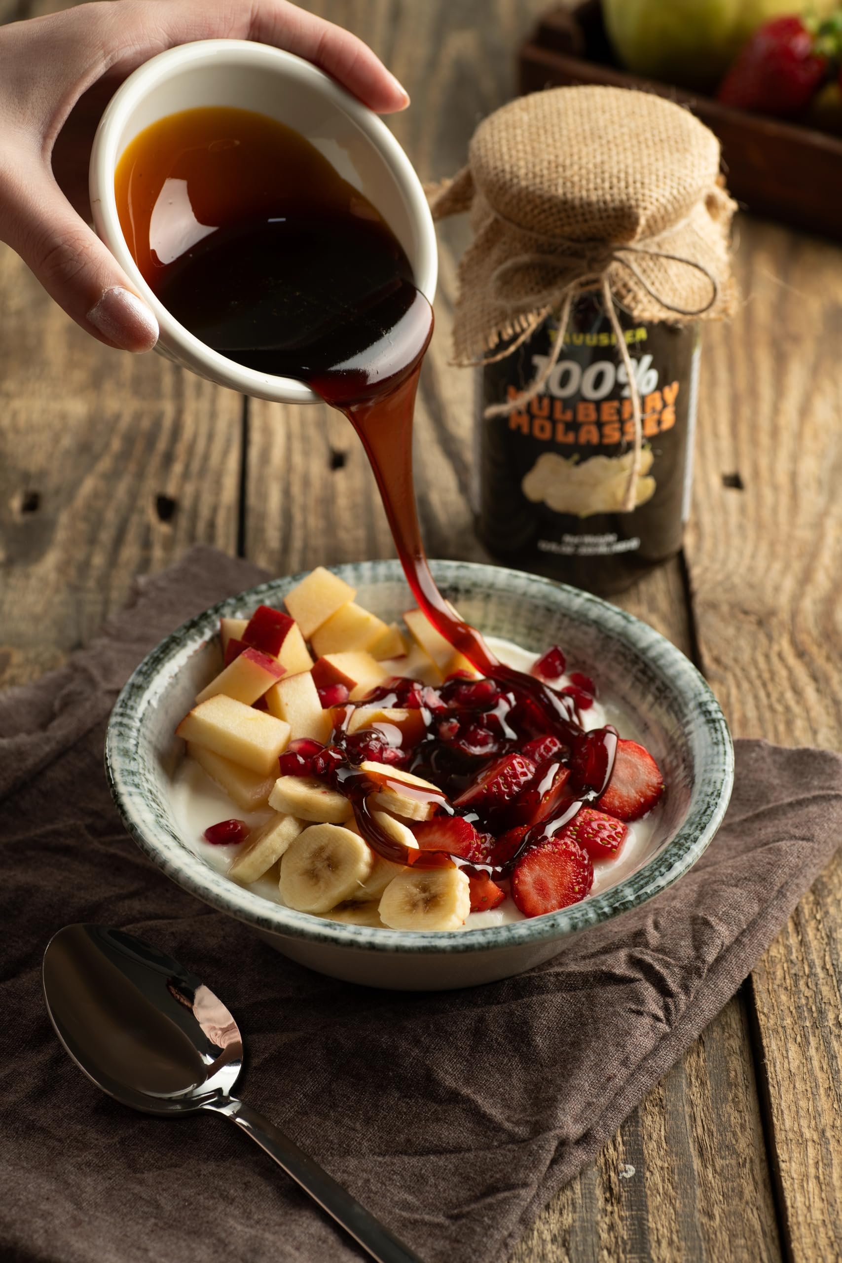 Tavusker spoon with molasses beside tahini showing pairing benefit for spreads