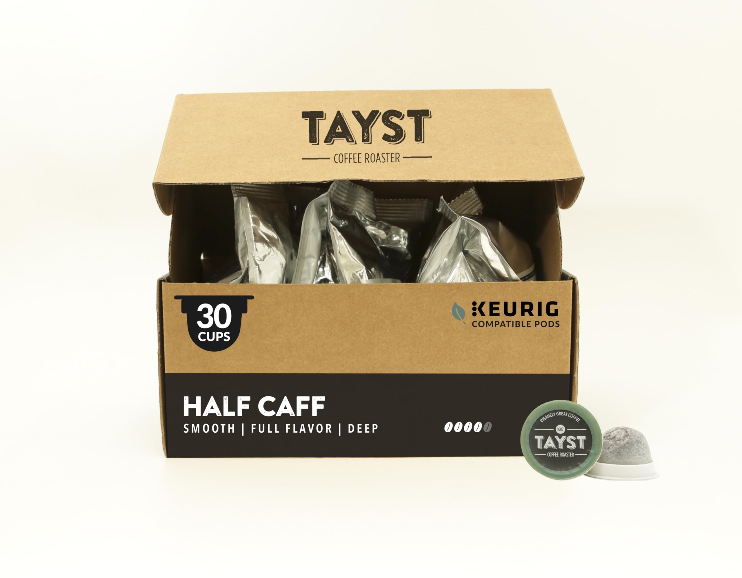 Tayst Coffee Roaster front packaging showing compostable pod and rich dark-roast benefit