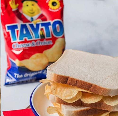 hand holding Tayto 37g pack showing single-serve convenience for on-the-go