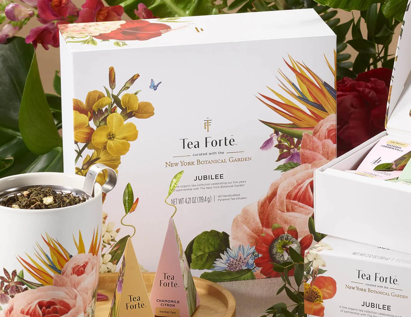 Tea Forté assorted pyramid sachets spread on wood showing variety and selection