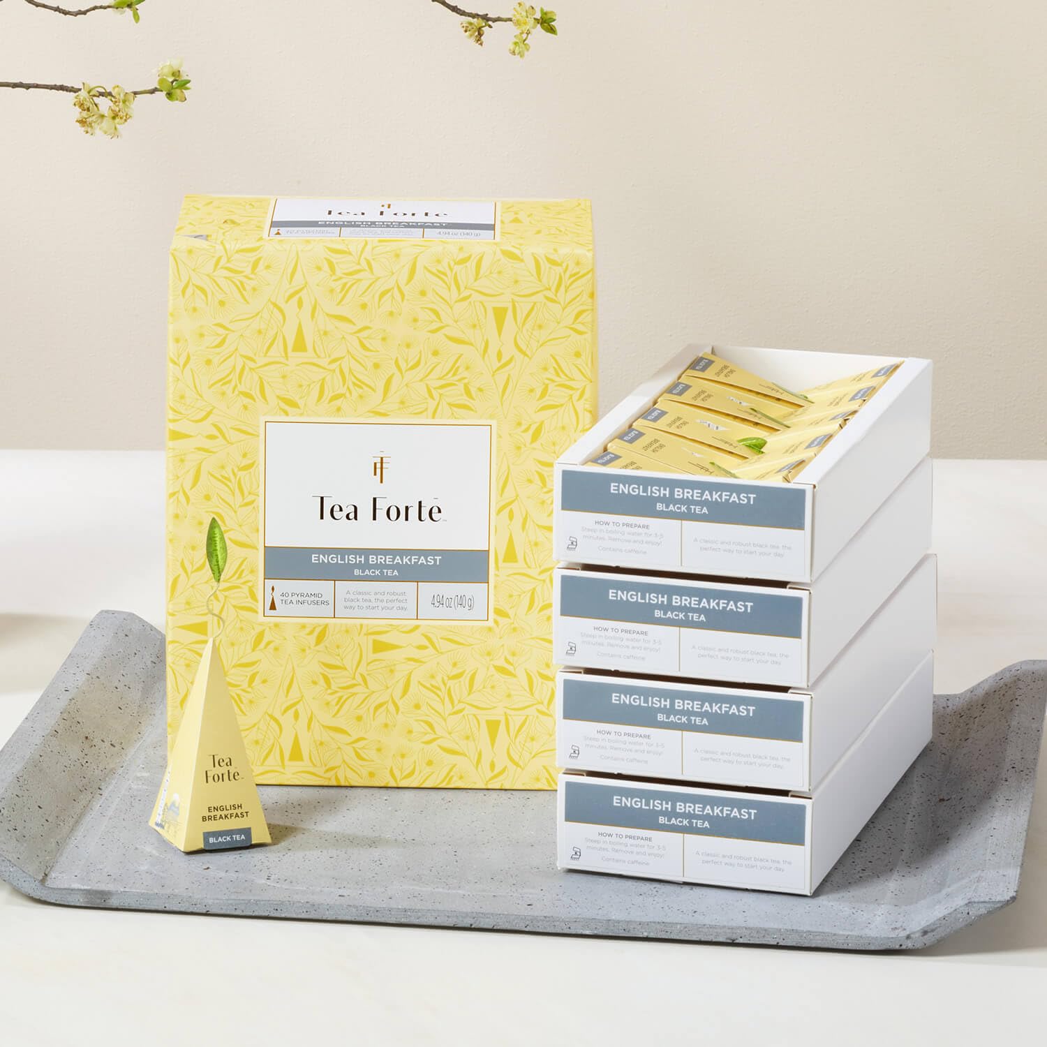 Tea Forte on breakfast table with pastries showing elegant serving appeal