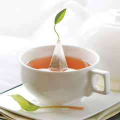 Tea Forte pyramid infuser close-up illustrating mesh design for full-leaf infusion benefit