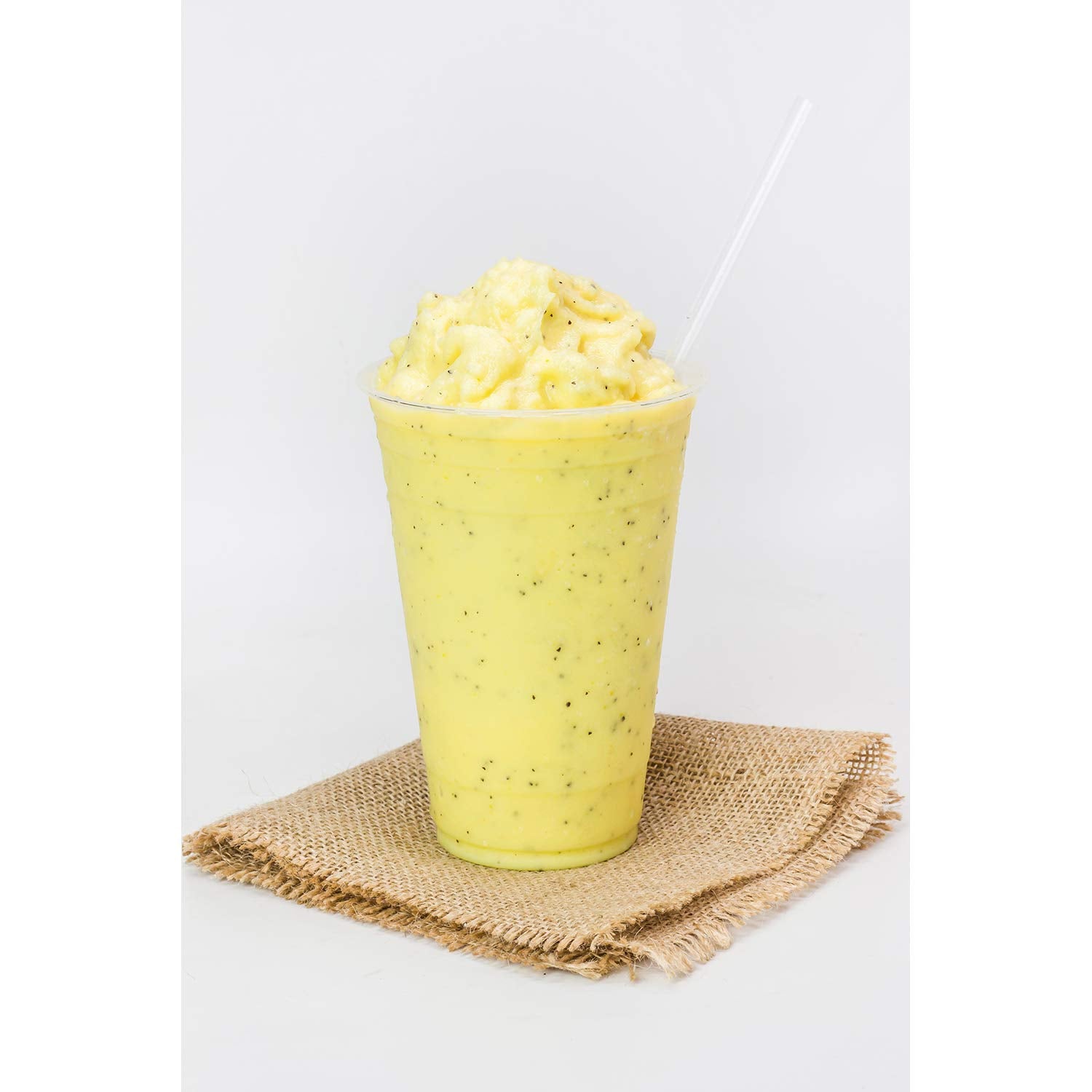 TEA ZONE bottle in a tropical setting suggesting fresh, summery flavor inspiration for menus
