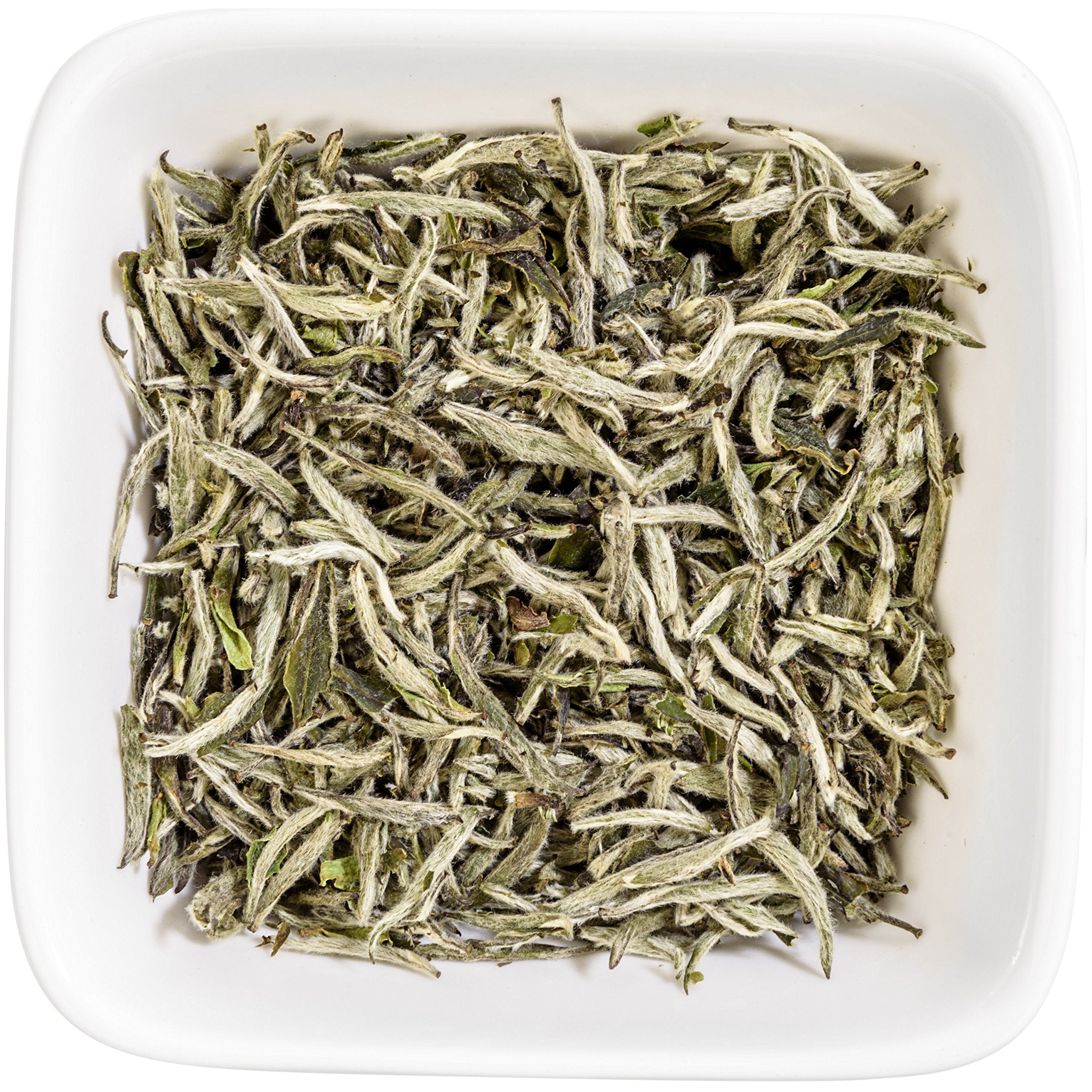 Tealyra loose leaves beside measuring spoon showing 110g scale and serving size