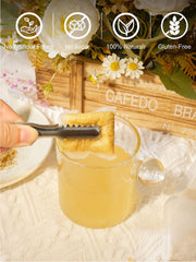Cup of brewed TeeLux ginger tea displaying warm amber color and steam rising