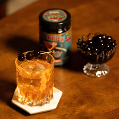 Tempus Fugit Spirits open jar top view revealing glossy Amarena cherries in syrup for rich flavor
