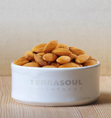 Terrasoul Superfoods almonds soaking in glass bowl demonstrating preparation for sprouting