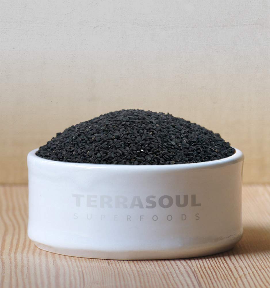 Terrasoul Superfoods seeds in wooden spoon showing serving size and easy seasoning benefit