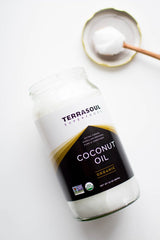 Terrasoul Superfoods coconut oil applied to hair and skin showing moisturizing benefit