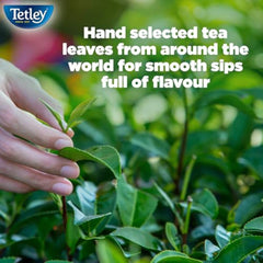 Tetley decaf tea bag steeping in cup demonstrating rich aroma release