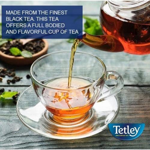 Tetley teabag beside spoon for scale demonstrating single-serving portability