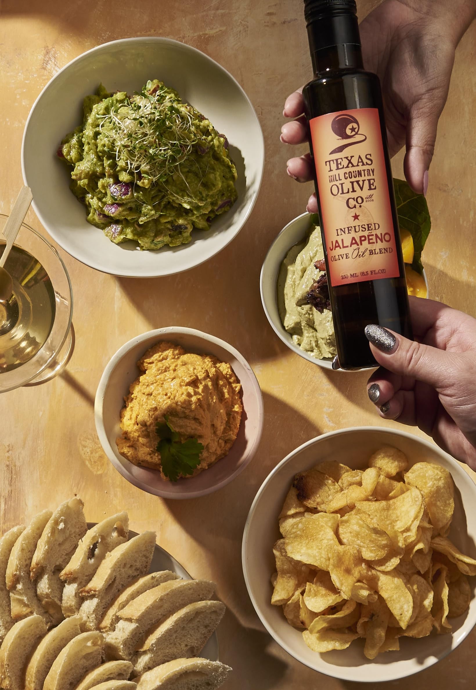 TEXAS HILL COUNTRY OLIVE CO. fresh olives and jalapeño ingredients shown