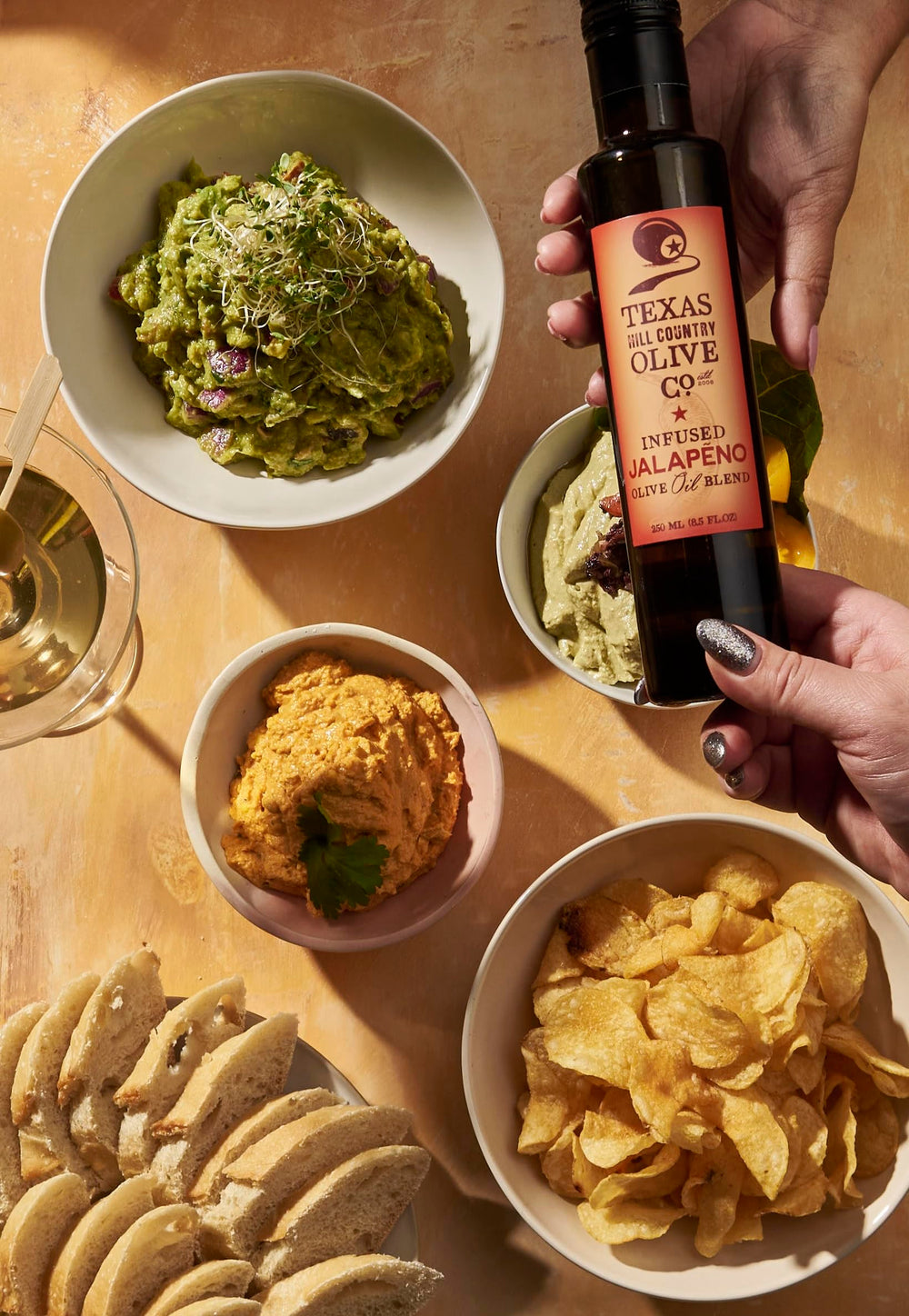 TEXAS HILL COUNTRY OLIVE CO. fresh olives and jalapeño ingredients shown