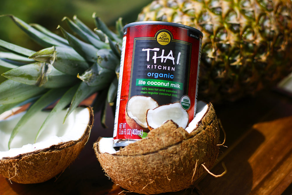 Thai Kitchen open can top view revealing lite coconut milk and easy-pour benefit