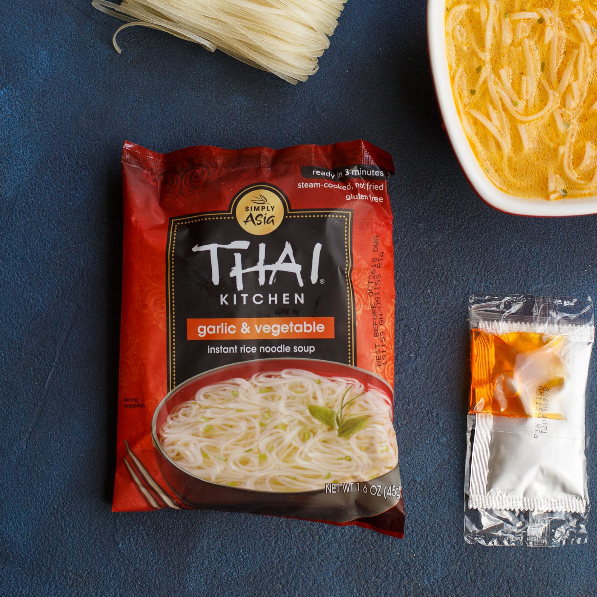 Bowl of Garlic & Vegetable Thai Kitchen soup with vegetables, savory comfort shown