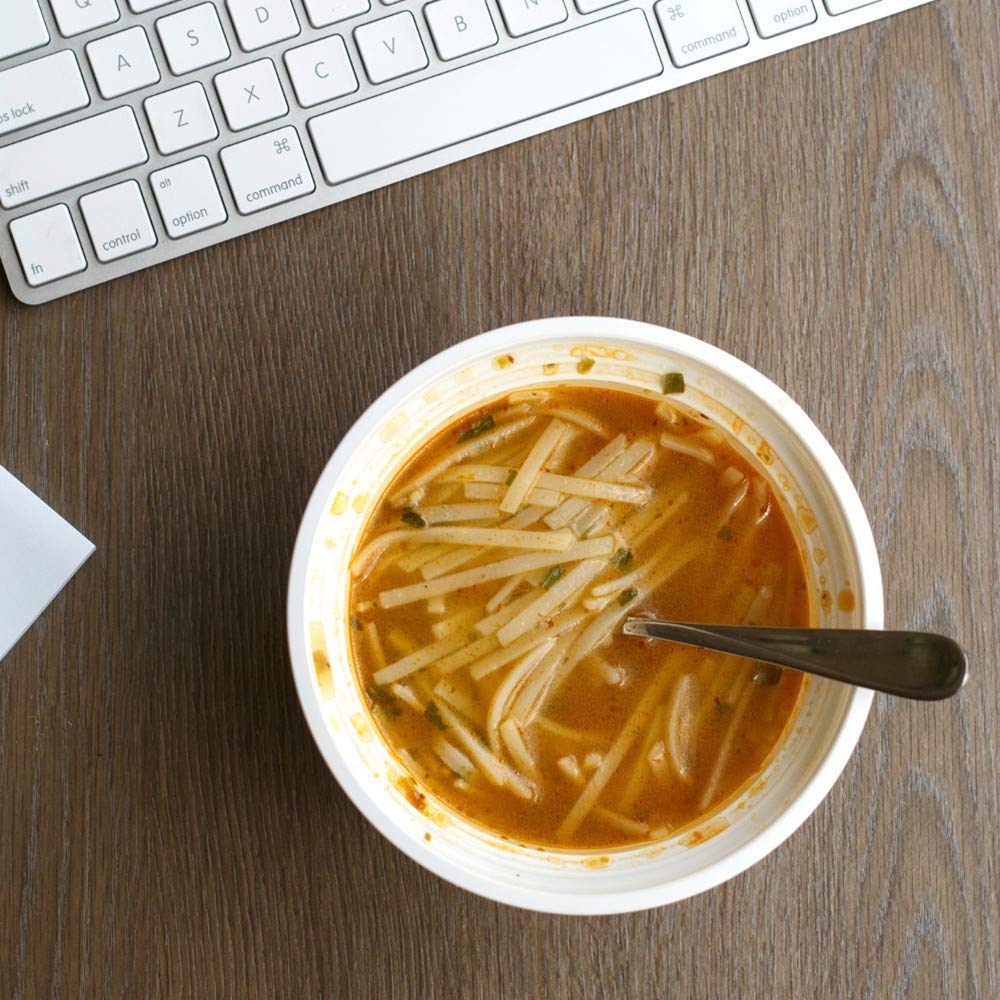 Thai Kitchen noodle soup on office desk portraying convenient quick meal solution