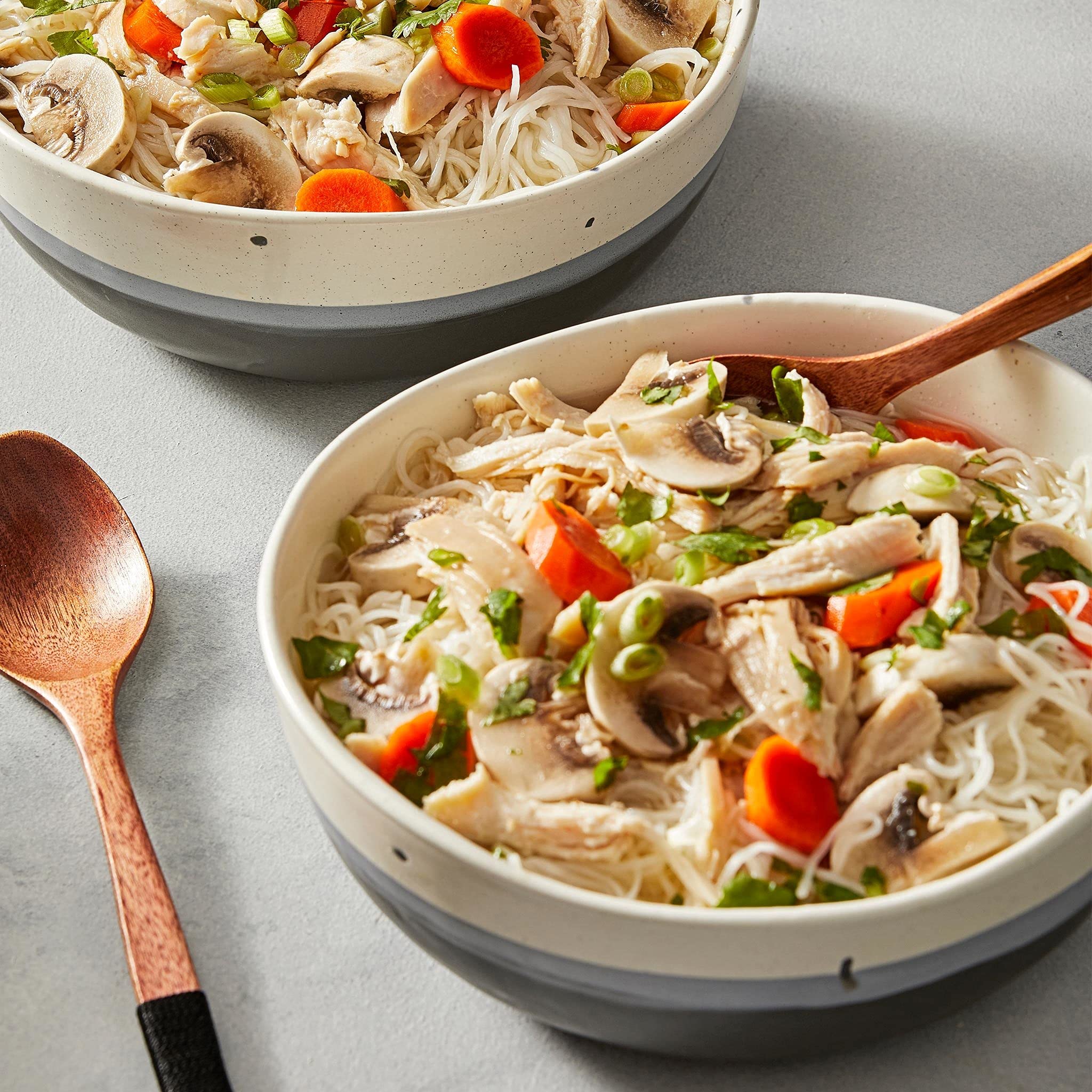 Thai Kitchen plated Pad Thai serving suggestion with vegetables and lime