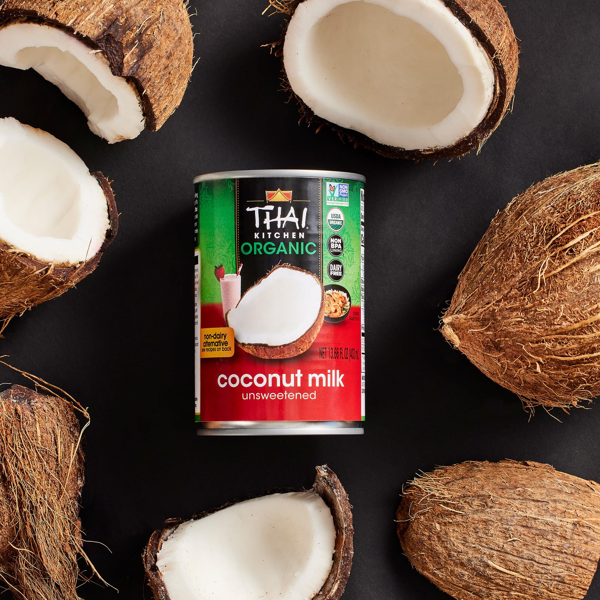 Thai Kitchen spoon lifting coconut cream showing thick full-fat texture for recipes