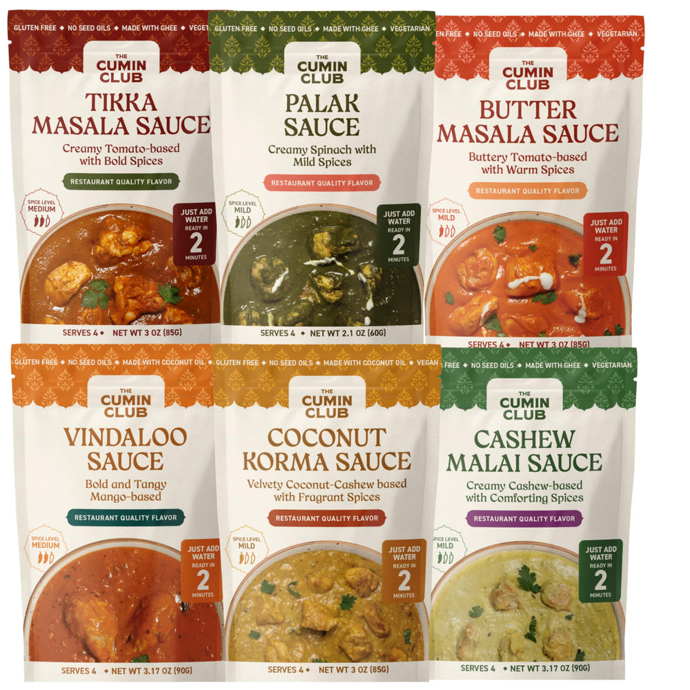 The Cumin Club front packaging showing all six simmer sauces and benefits