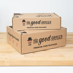 The Good Grocer open box revealing 25 individually wrapped vegan gluten-free snacks with variety benefit