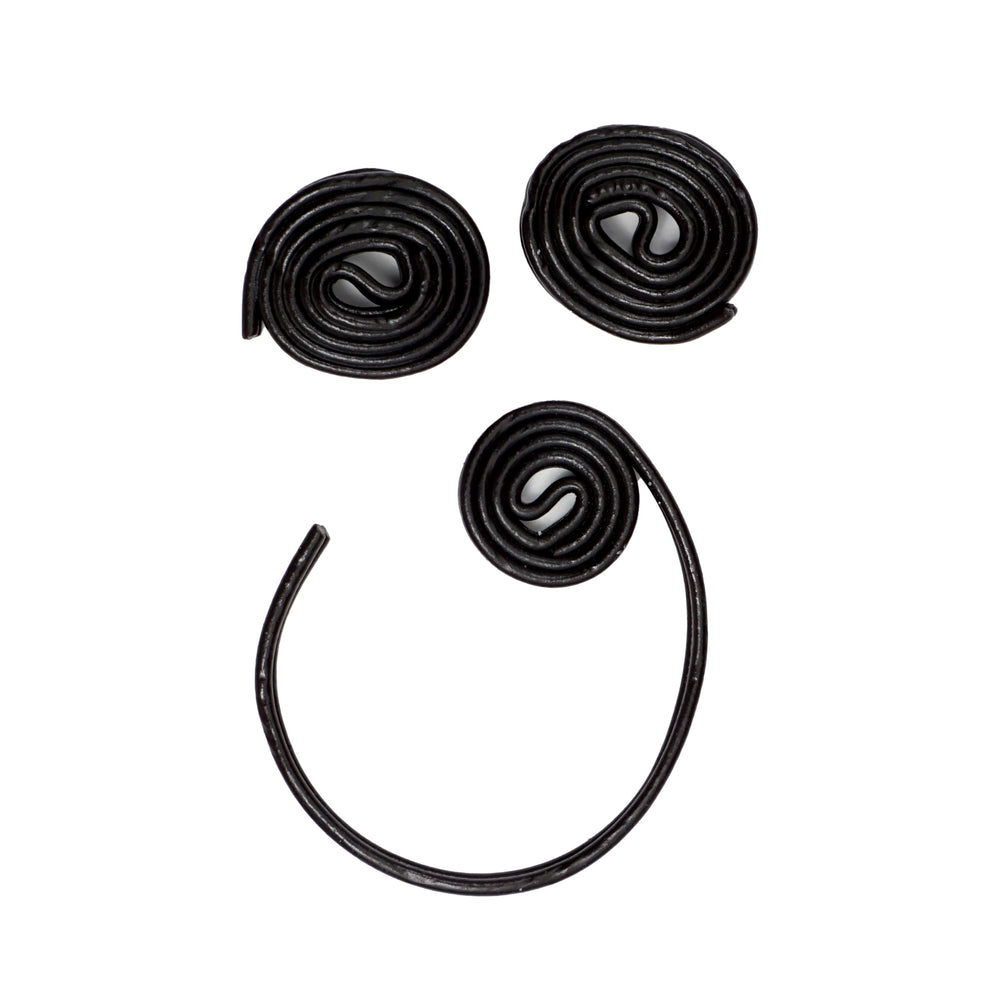 THE HAMPTON CANDY COMPANY hand holding a wheel to show size and portion control