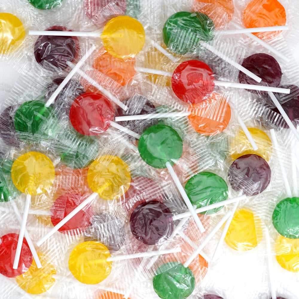 THE HAMPTON CANDY COMPANY single lollipop in hand demonstrating portable snack ease