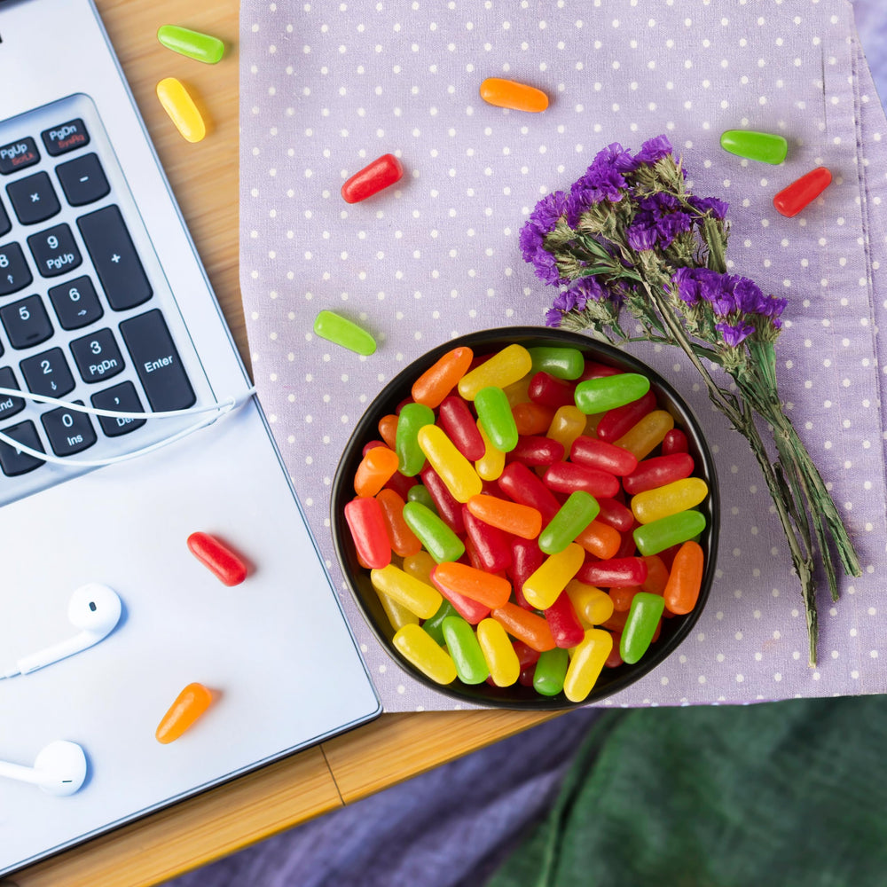 THE HAMPTON CANDY COMPANY party bowl filled with boxes showing convenient entertaining option